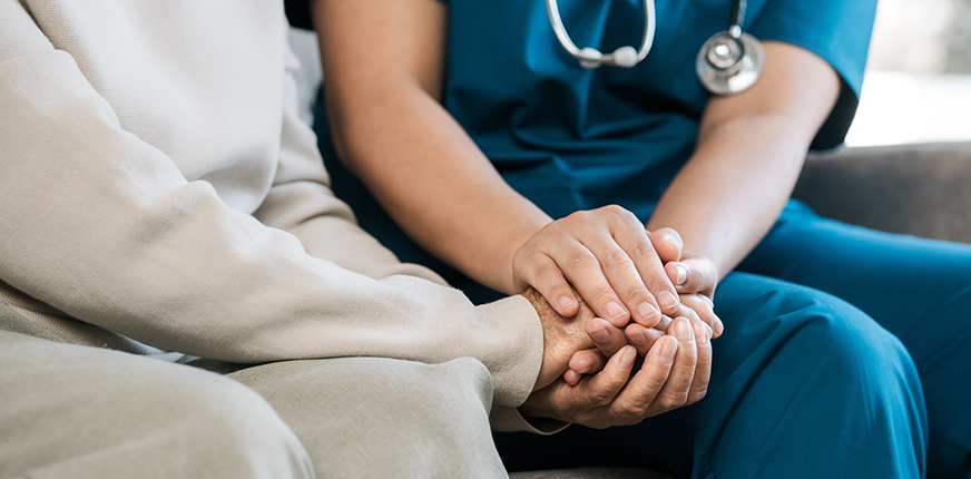 Provider holding patient's hands
