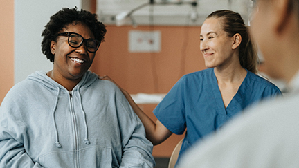 patient and care taker smiling