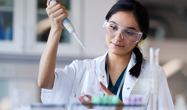 Pharma resident working with a pipette